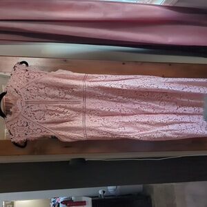 Pale pink, embroidered dress.